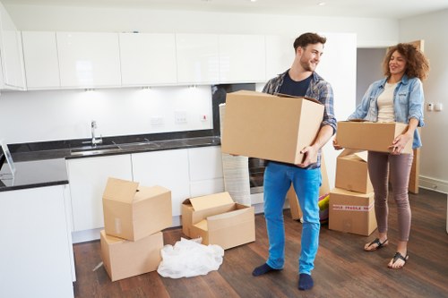 Professional moving team handling furniture for a Leytonstone home