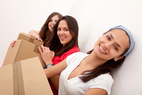 Professional movers handling furniture for a home move in Leytonstone