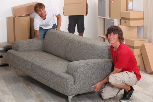 Boxes and furniture being loaded into a removals van