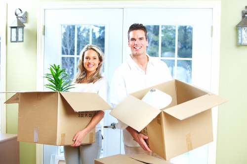 Movers handling desks and equipment during a Leytonstone office move