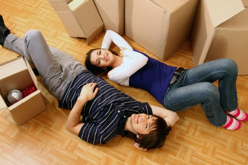 Removal team loading business furniture and stock for a commercial relocation in Leytonstone